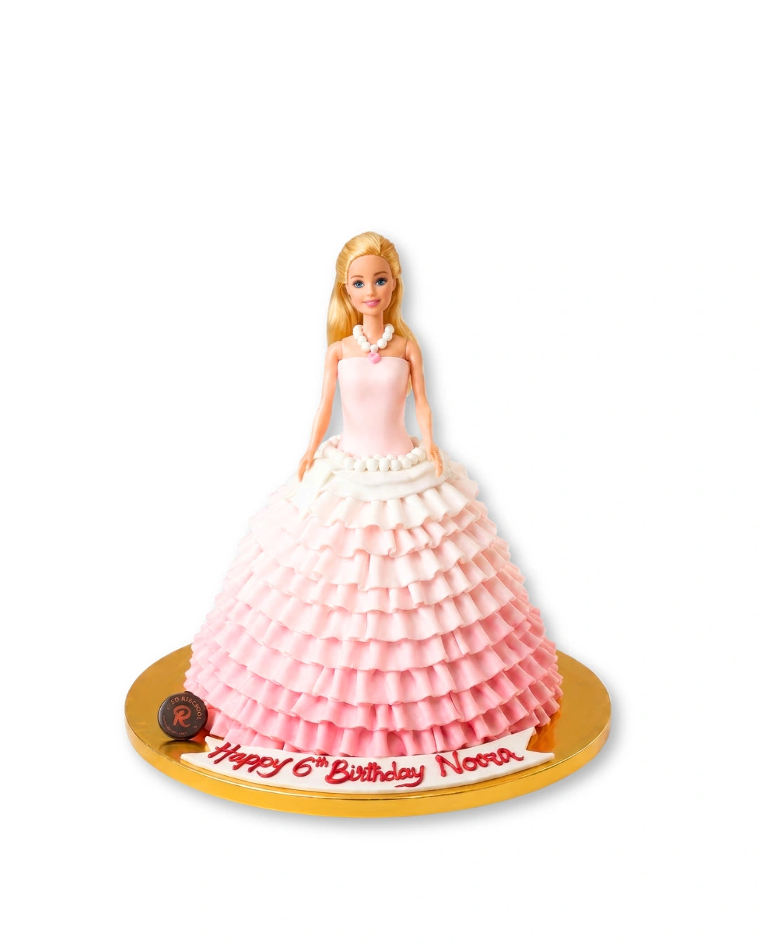 Barbie Doll cake by Red Ribbon Cakes with pink gown design and doll topper, elegant birthday cake for girls in Dubai
