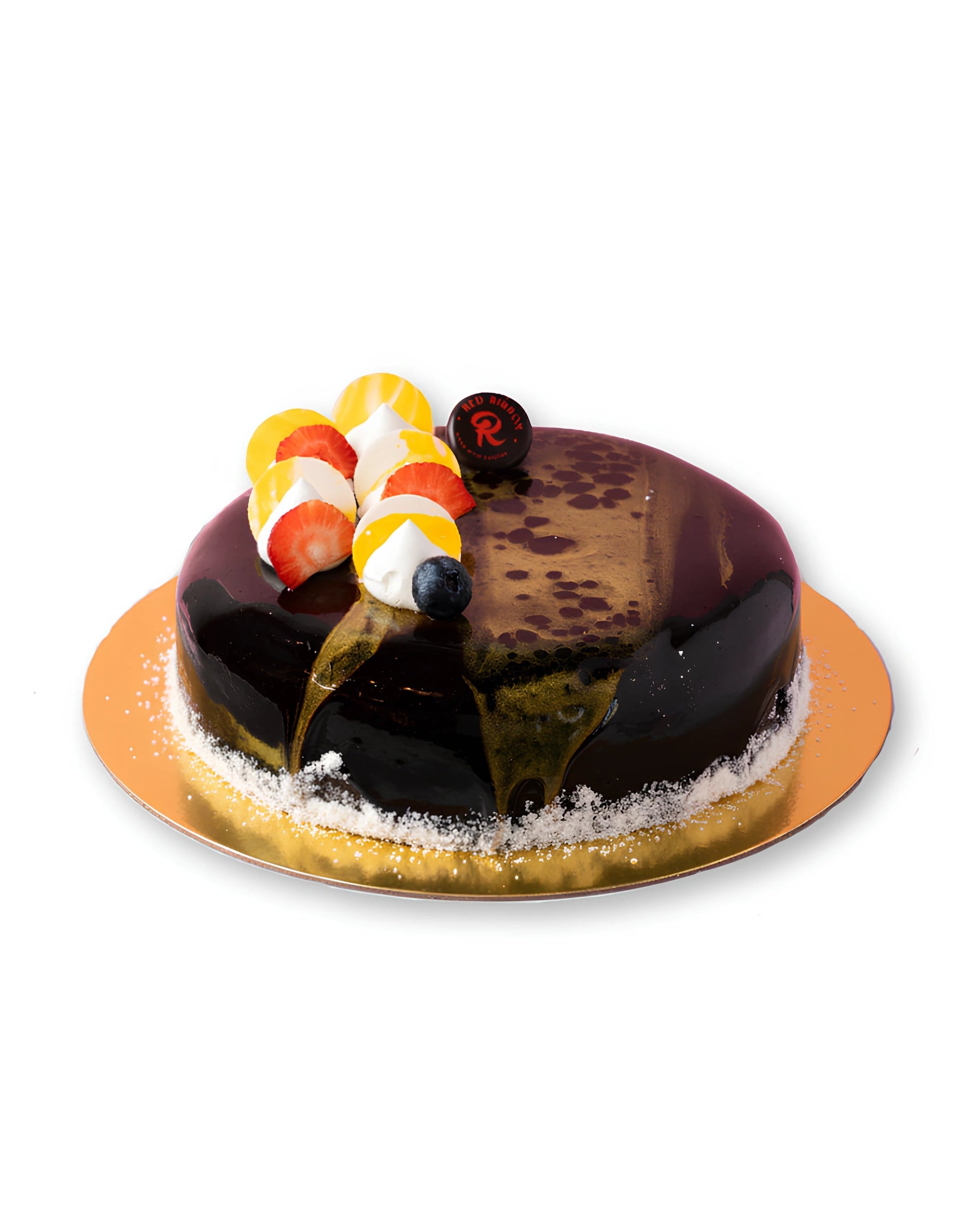 Classic chocolate ganache cake with glossy dark chocolate glaze, fresh strawberries, blueberries, whipped cream topping, and elegant finish on a gold cake board