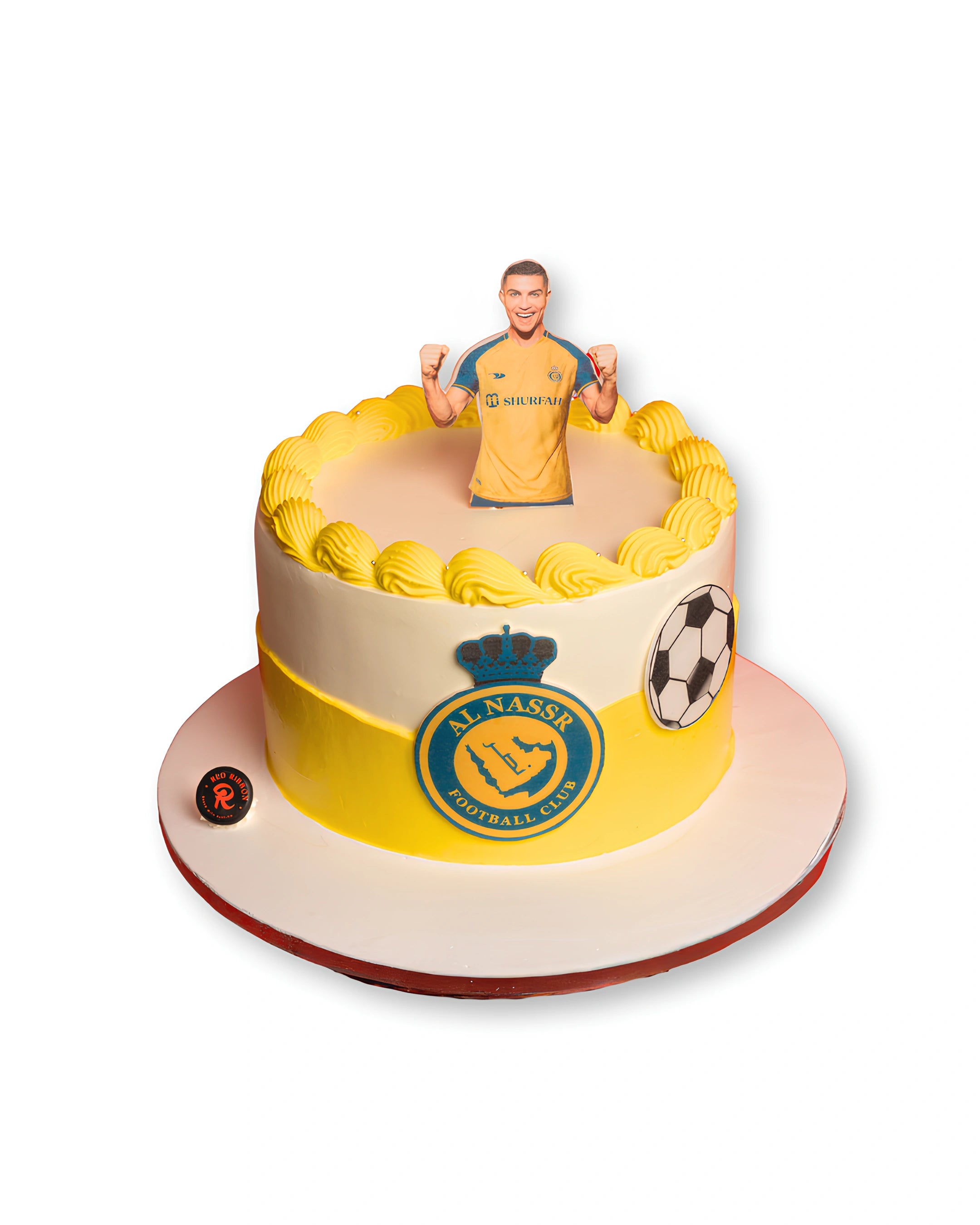 Cristiano Ronaldo themed birthday cake by Red Ribbon Cakes in Al Nassr yellow colors with football topper, custom football fan cake in Dubai