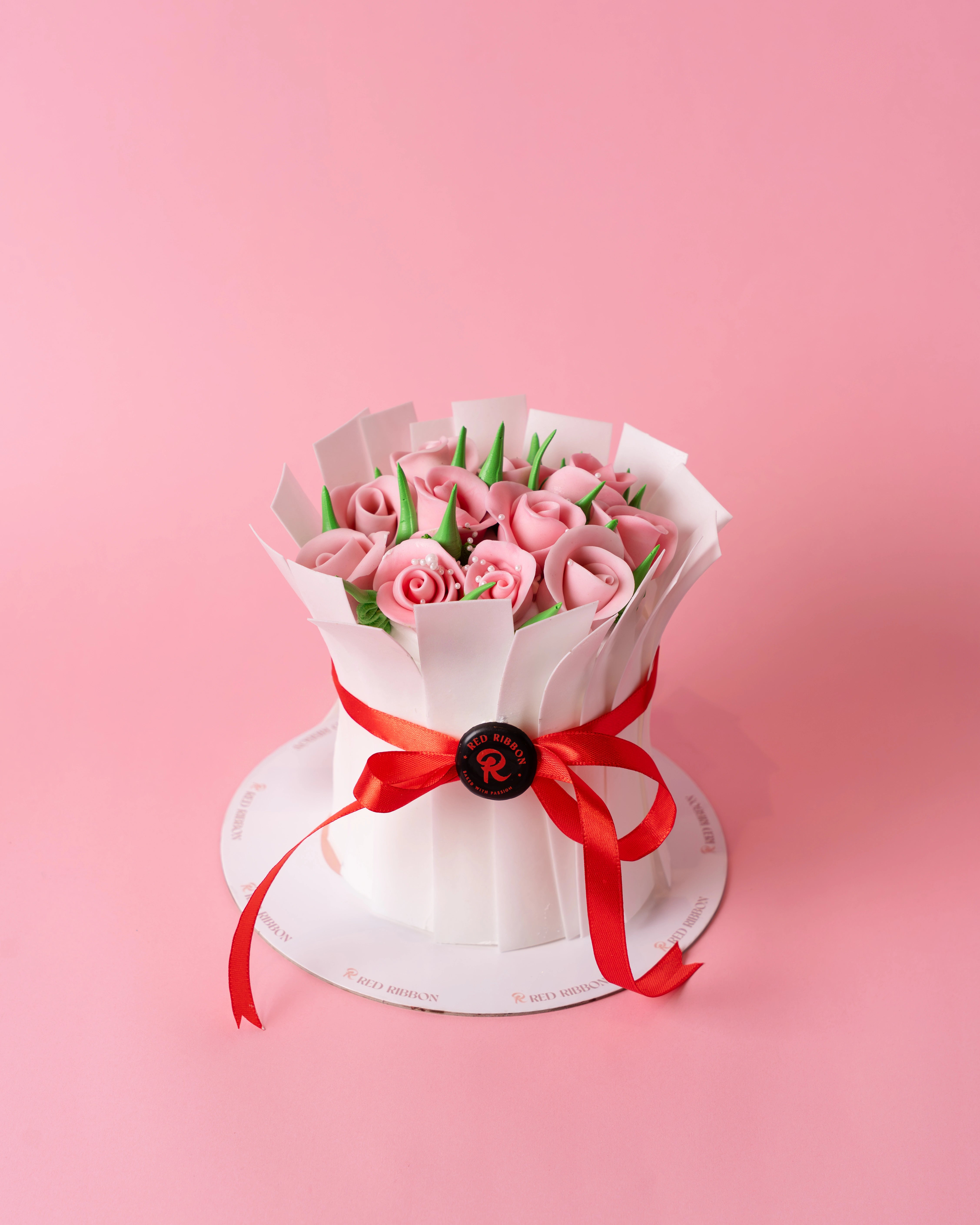 the flower basket cake from red ribbon is the best cake in dubai for valentine's day, designed with beautiful red icing roses and an elegant white finish to mimic a real floral basket.