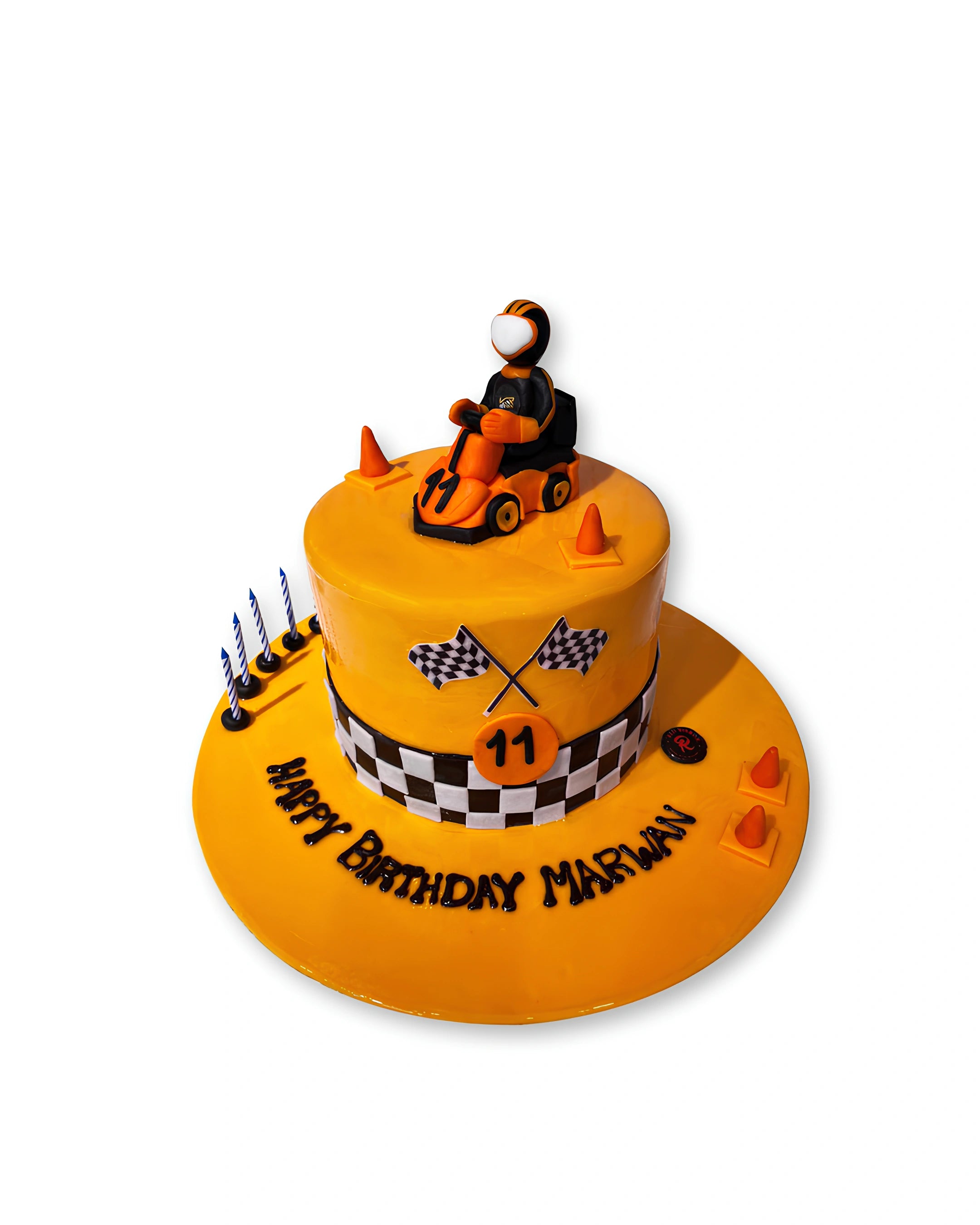 Go kart racing themed birthday cake by Red Ribbon Cakes with checkered flag design and racer topper, kids racing cake in Dubai