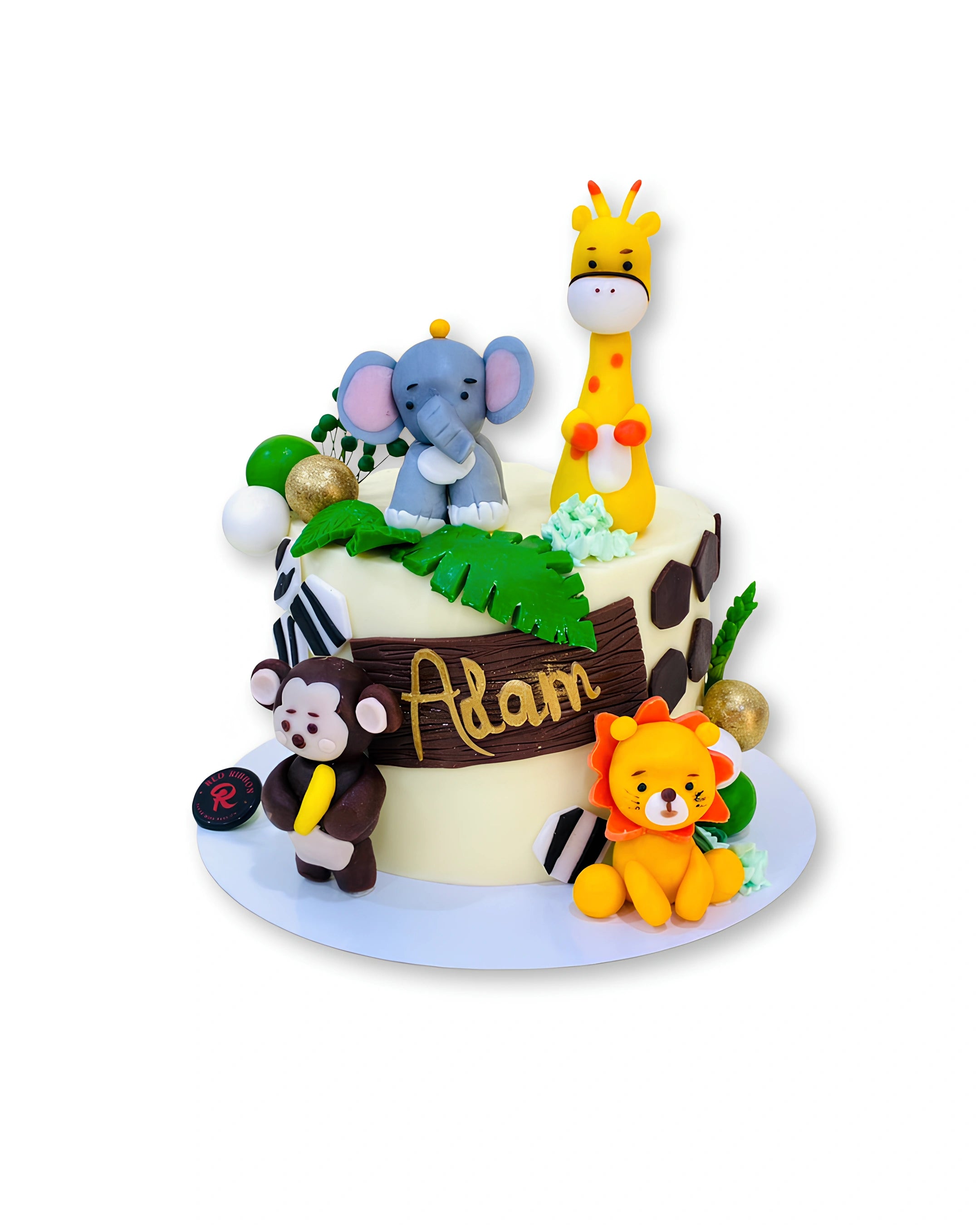 Jungle Safari themed cake by Red Ribbon Cakes with cute animal toppers, fun birthday cake for kids in Dubai
