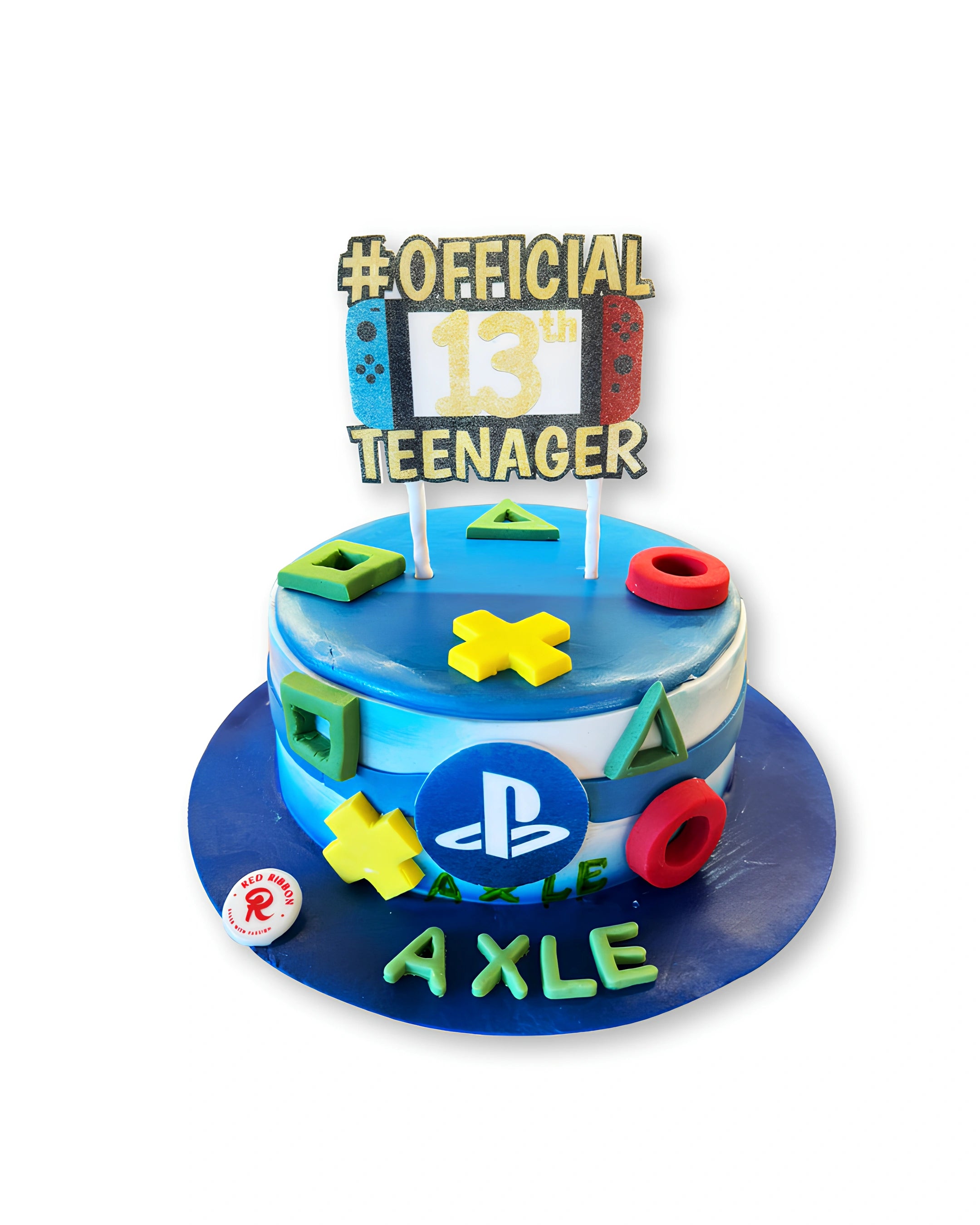 PlayStation themed birthday cake by Red Ribbon Cakes with gaming controller symbols and blue design, custom teenage birthday cake in Dubai