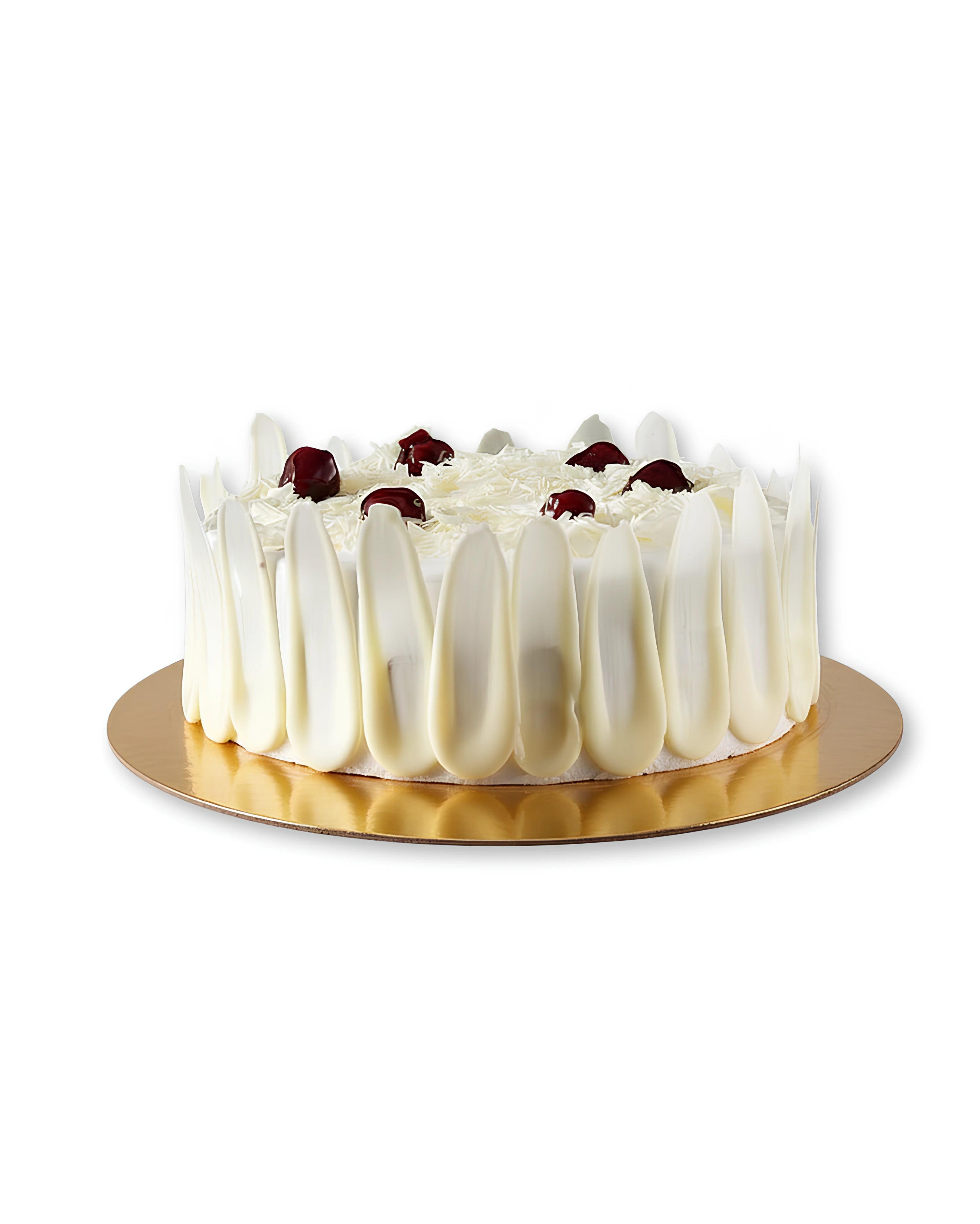 White Forest cake topped with cherries and white chocolate shavings from Red Ribbon Cakes in Dubai