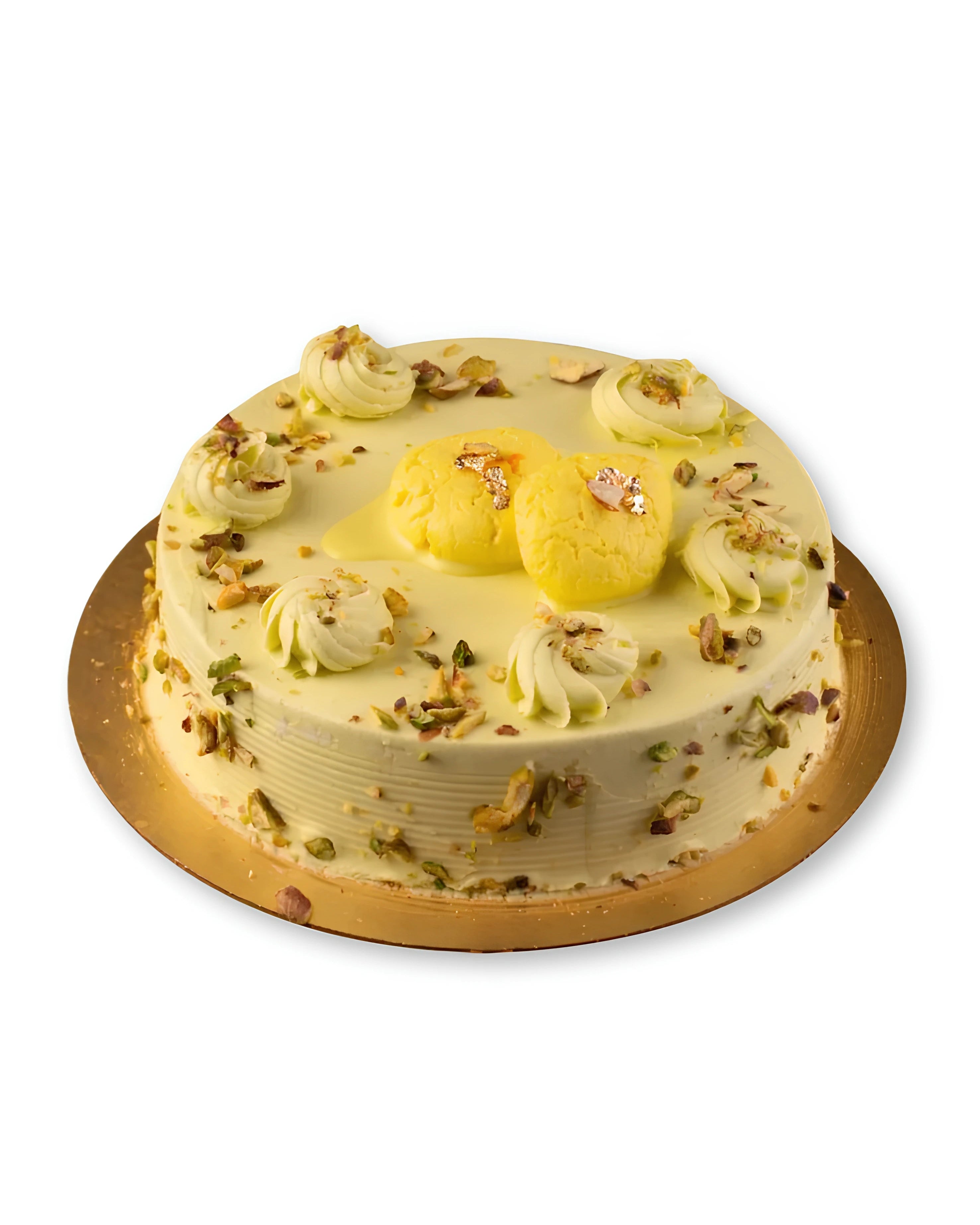 Rasmalai cake topped with pistachios and saffron cream by Red Ribbon Cakes Dubai
