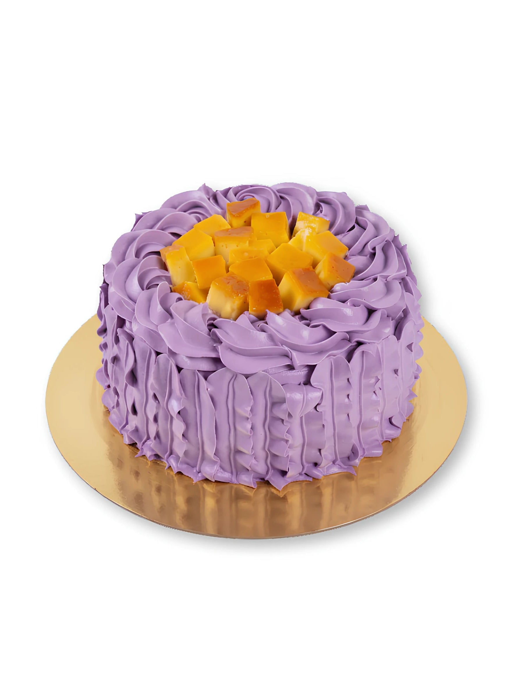 Ube Flan Cake finished with soft ube frosting and fresh fruit topping by Red Ribbon Cakes