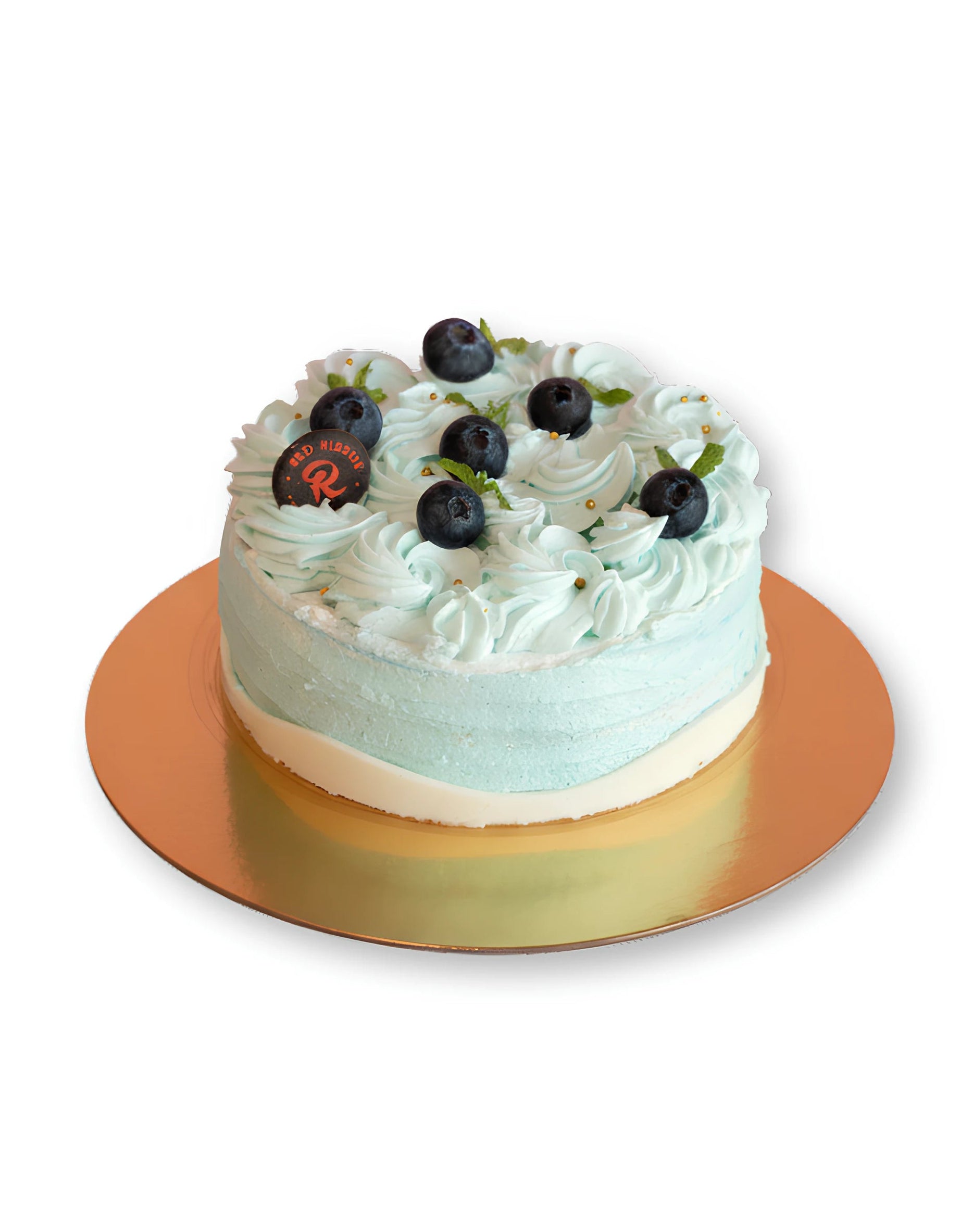 White chocolate Blueberry Cake topped with blueberry cream swirls and fresh blueberries by Red Ribbon Cakes